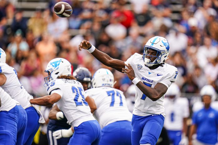 Buffalo Bulls quarterback C.J. Ogbonna (7) throws a pass against the Connecticut Huskies in the first quarter at Rentschler Field at Pratt & Whitney Stadium.