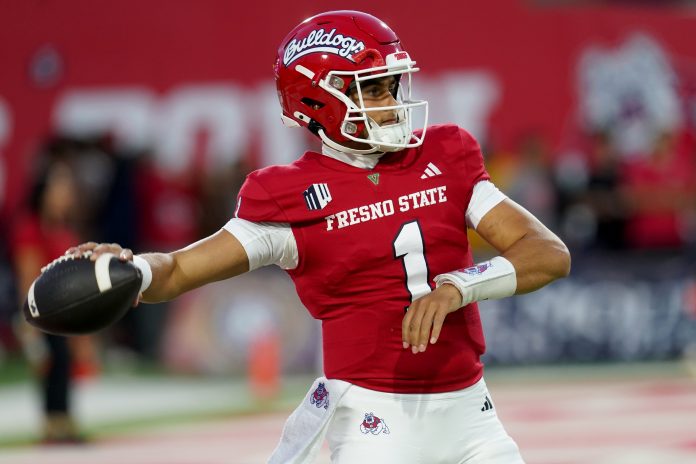 Fresno State Bulldogs quarterback Mikey Keene (1) throws a pass during warmups against the Nevada Wolf Pack at Valley Children's Stadium.