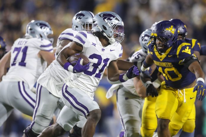 Kansas State Wildcats running back DJ Giddens (31) runs during the first quarter against the West Virginia Mountaineers at Mountaineer Field at Milan Puskar Stadium.