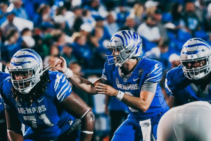 Memphis Tigers’ Seth Henigan (9) calls out a play against MTSU during a football game on Saturday, Sept. 28, 2024 at the Simmons Liberty Bank Stadium.