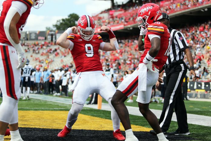 Maryland Terrapins wide receiver Tai Felton (10) celebrates with quarterback Billy Edwards Jr. (9) after scoring a touchdown against the Villanova Wildcats during the third quarter at SECU Stadium.