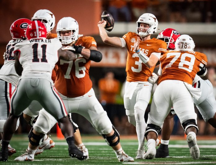 Texas Longhorns quarterback Quinn Ewers (3) throws a pass against the Georgia Bulldogs in the fourth quarter at Darrell K. Royal Texas Memorial Stadium.