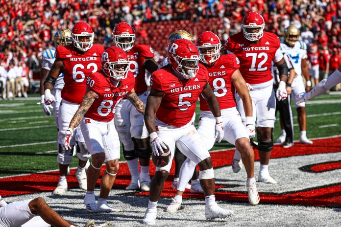 Rutgers Scarlet Knights running back Kyle Monangai (5) scores on a rushing touchdown during the second half against the UCLA Bruins at SHI Stadium.