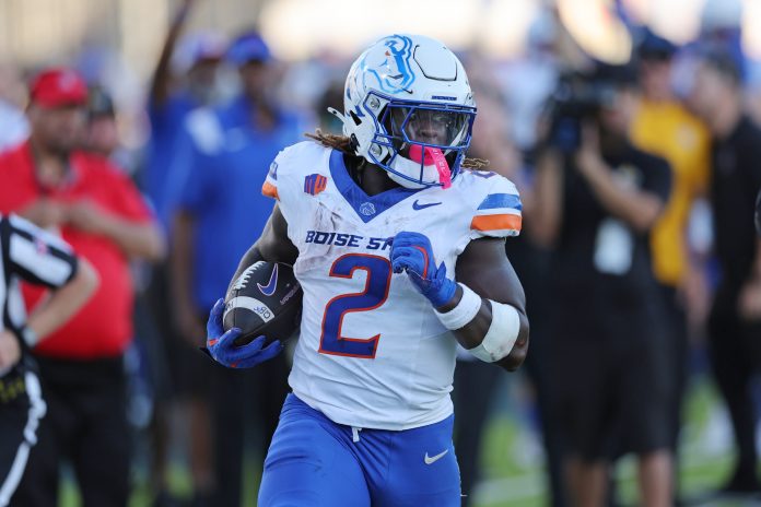 Boise State Broncos running back Ashton Jeanty (2) cuts through the Hawaii Rainbow Warriors defense for a touchdown during the first quarter at Clarence T.C. Ching Athletics Complex.