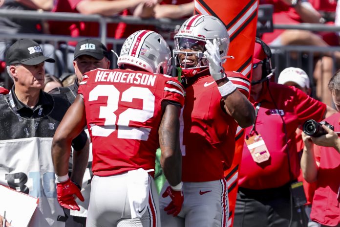 Ohio State Buckeyes running back TreVeyon Henderson (32) celebrates the touchdown with running back Quinshon Judkins (1) during the second quarter against the Marshall Thundering Herd at Ohio Stadium.