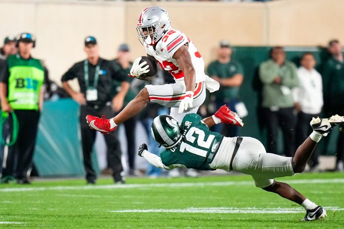 Everything you need to know about Ohio State RB TreVeyon Henderson, including his NIL valuations, NFL Draft stock, player comps, and more.