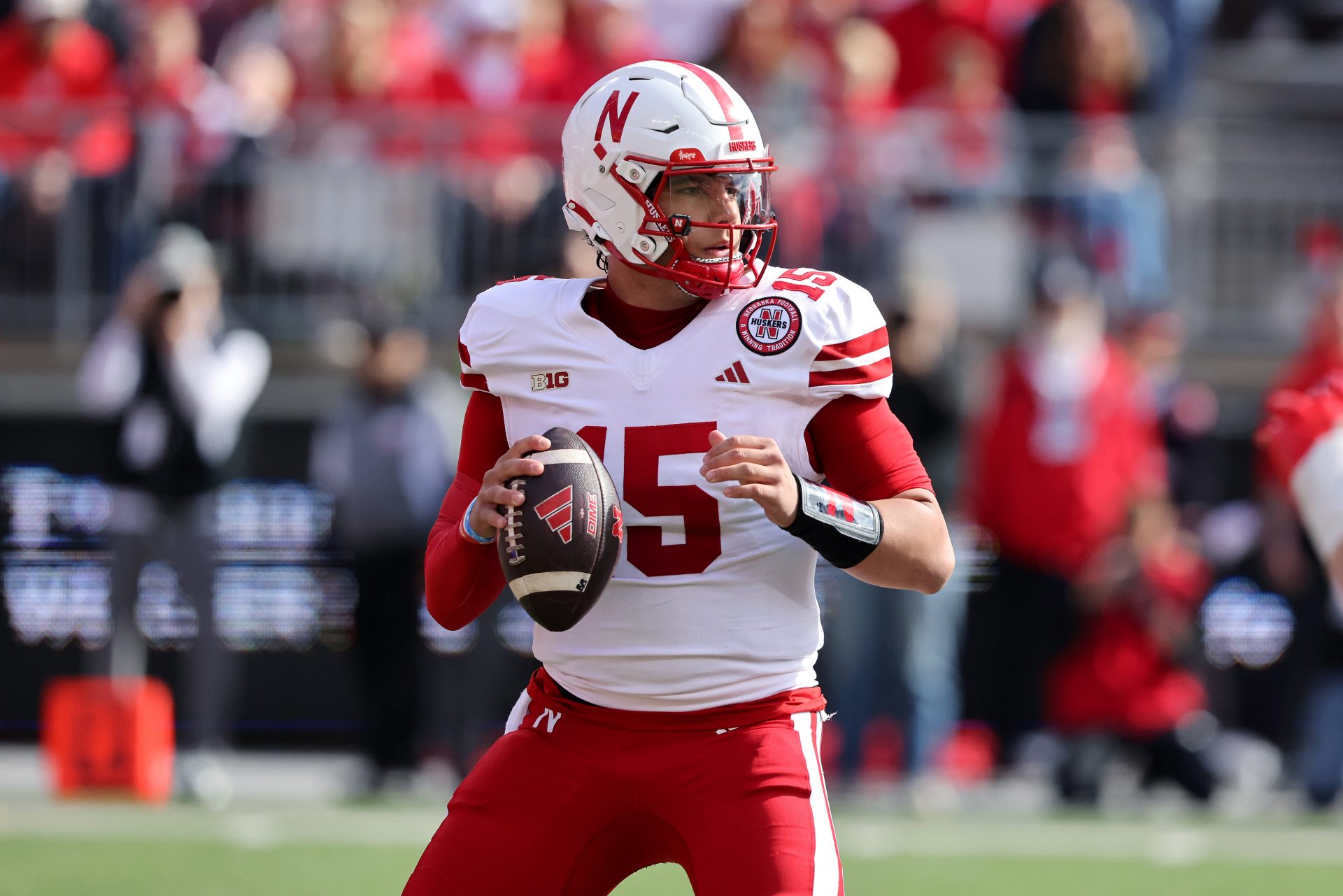 Nebraska Cornhuskers quarterback Dylan Raiola (15) drops to throw during the first quarter against the Ohio State Buckeyes at Ohio Stadium.