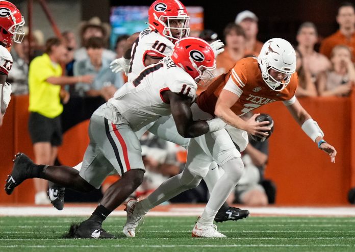 Georgia Bulldogs linebacker Jalon Walker sacks Texas Longhorns quarterback Quinn Ewers in the second quarter at Darrell K. Royal Texas Memorial Stadium.