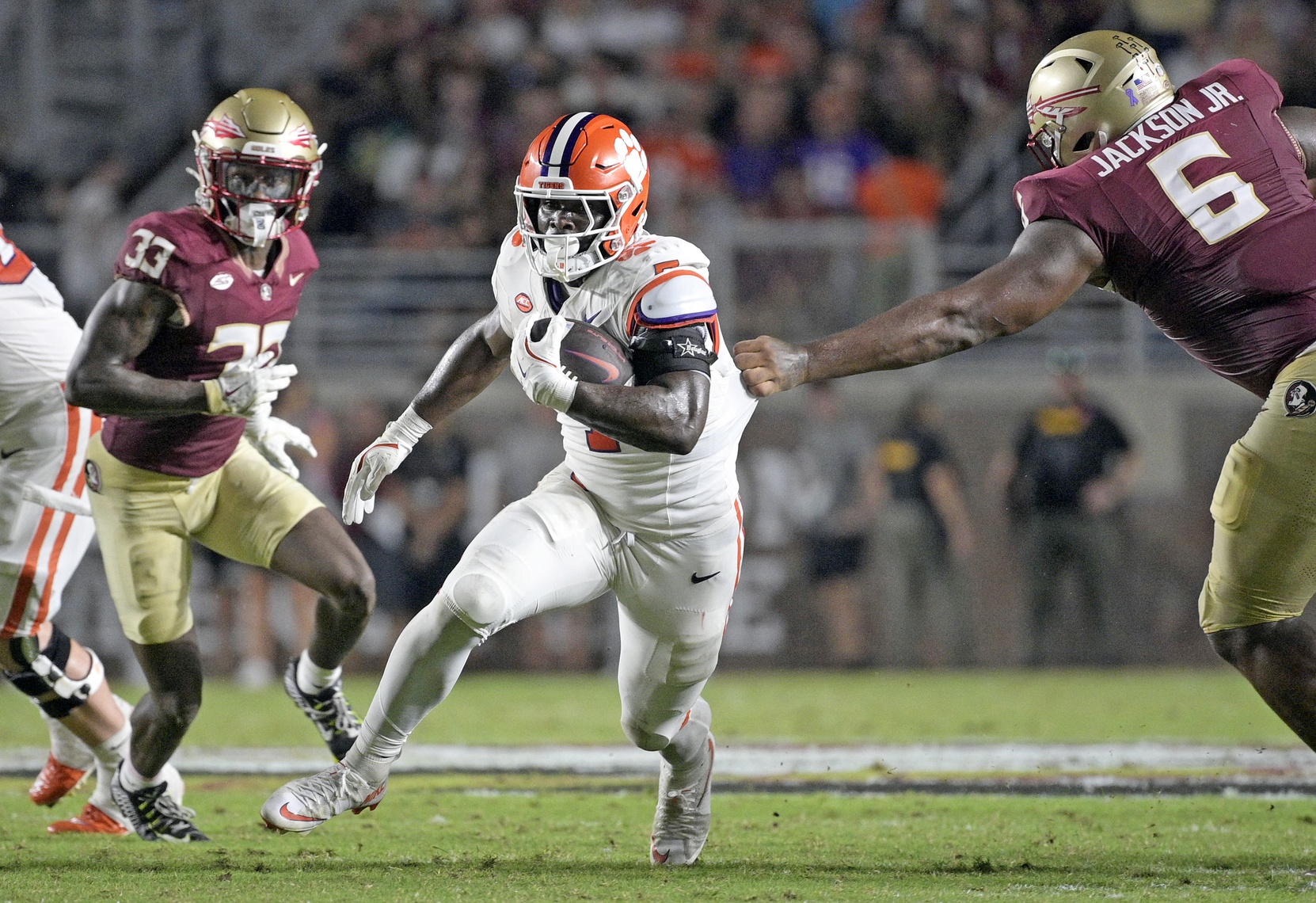 Clemson Tigers running back Phil Mafah (7) runs up the field against the Florida State Seminoles during the second half at Doak S. Campbell Stadium.