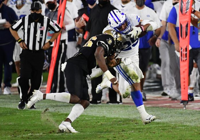 UCF Knights defensive back Jermaine McMillian (26) hits Brigham Young Cougars defensive back Samuel Allred (25) during the second half at FAU Stadium.