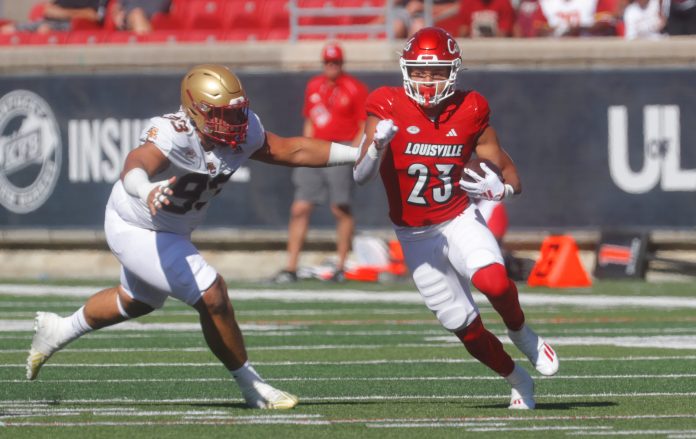 Louisville’s Isaac Guerendo gets a first down against Boston College Saturday afternoon in L & N Stadium.