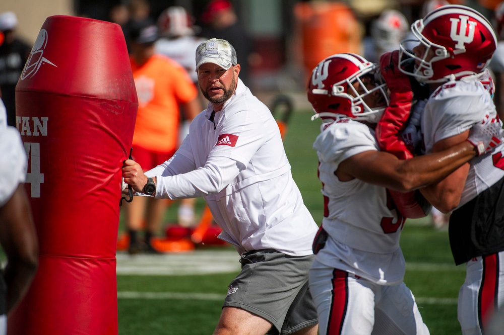 Indiana University Defensive Coordinator Bryant Haines instructs players during fall practice at the Mellencamp Pavilion at Indiana University.