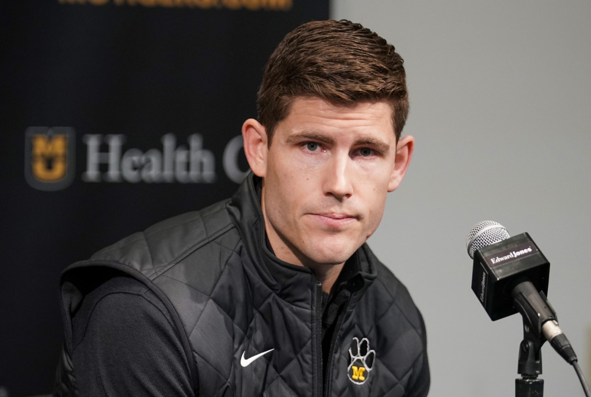 Missouri Tigers football team new offensive coordinator/quarterbacks coach Kirby Moore answers questions from reporters before the basketball game against the Vanderbilt Commodores Mizzou Arena.