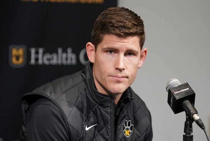 Missouri Tigers football team new offensive coordinator/quarterbacks coach Kirby Moore answers questions from reporters before the basketball game against the Vanderbilt Commodores Mizzou Arena.