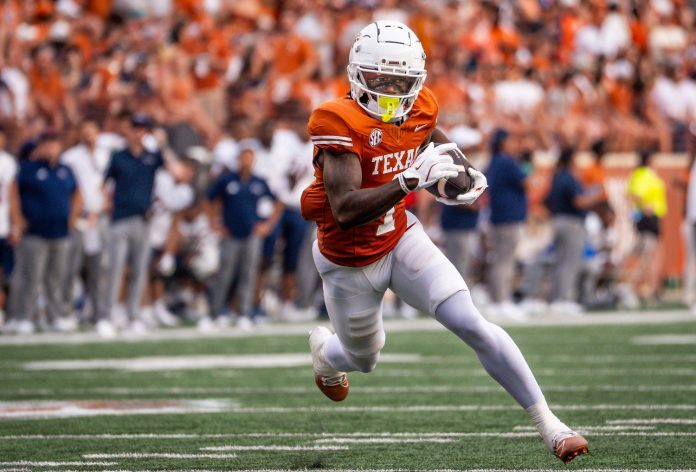 Texas Longhorns wide receiver Johntay Cook II (1) runs the ball in for the Longhorns' second touchdown in the first quarter of the game against the UTSA Roadrunners at Darrell K RoyalÐTexas Memorial Stadium.