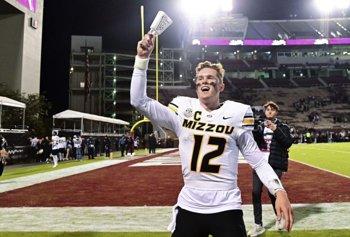 Missouri Tigers quarterback Brady Cook (12) reacts after defeating the Mississippi State Bulldogs at Davis Wade Stadium at Scott Field.