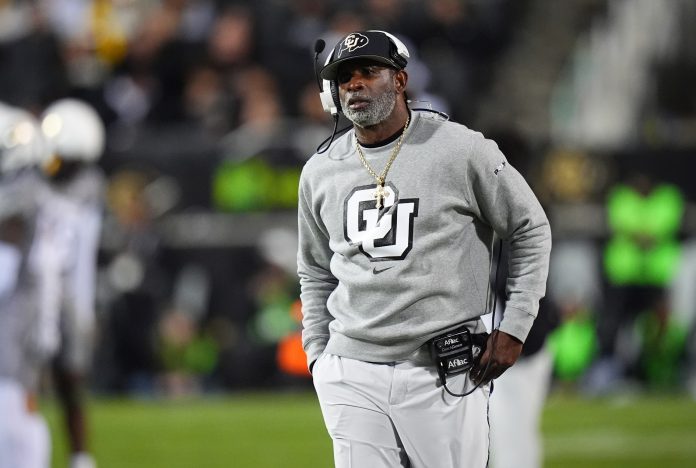 Colorado Buffaloes head coach Deion Sanders walks the sidelines in the second half against the Cincinnati Bearcats at Folsom Field.