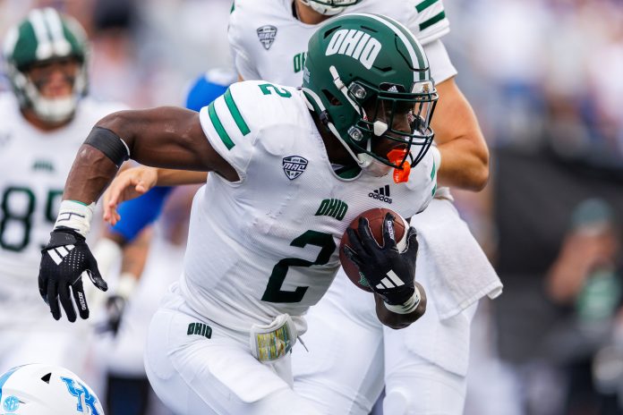 Ohio Bobcats running back Anthony Tyus III (2) runs the ball during the first quarter against the Kentucky Wildcats at Kroger Field.