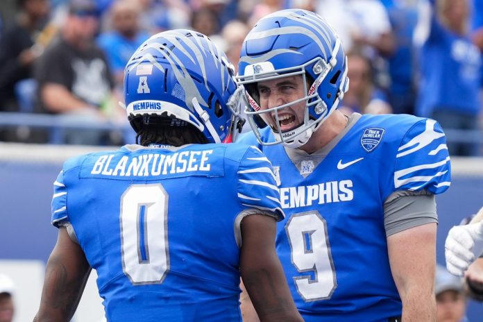 Memphis' Demeer Blankumsee (0) and Seth Henigan (9) celebrate after Blankumsee scored a touchdown during the game between Charlotte and the University of Memphis at Simmons Bank Liberty Stadium on Saturday, October 26, 2024.