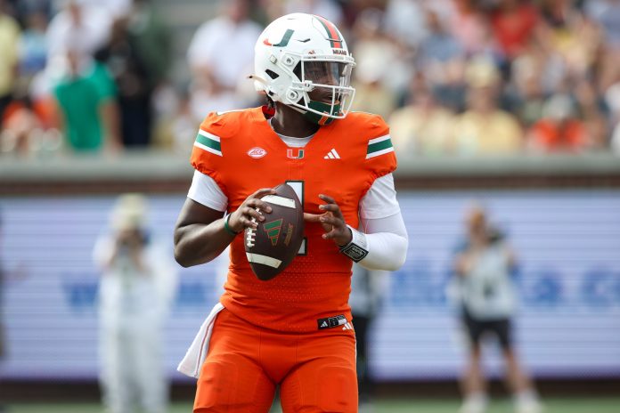 Miami Hurricanes quarterback Cam Ward (1) drops back to pass against the Georgia Tech Yellow Jackets in the third quarter at Bobby Dodd Stadium at Hyundai Field.