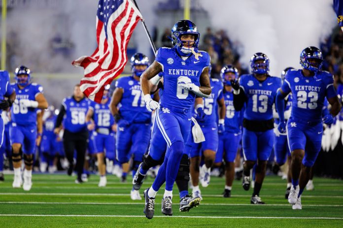 Kentucky Wildcats wide receiver Dane Key (6) runs onto the field before the game against the Auburn Tigers at Kroger Field.