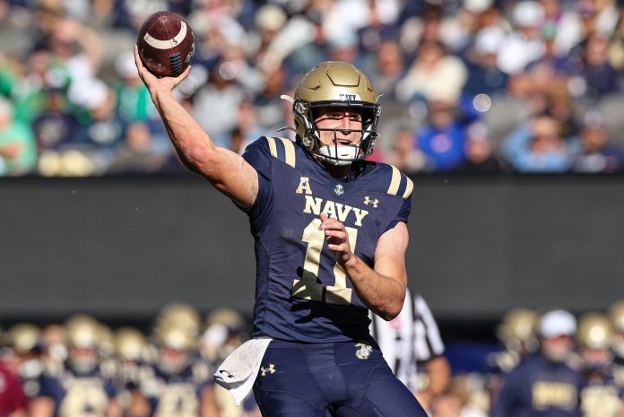 Navy Midshipmen quarterback Blake Horvath (11) passes the ball during the second half against the Notre Dame Fighting Irish at MetLife Stadium.