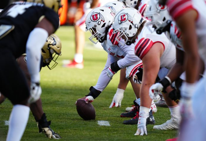 Utah Utes offensive lineman Paul Maile (54) lines up across from the Colorado Buffaloes in the first quarter at Folsom Field.