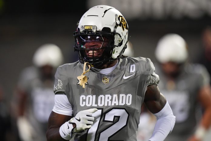 Colorado Buffaloes wide receiver Travis Hunter (12) reacts after touchdown reception in the first quarter against the Cincinnati Bearcats at Folsom Field.