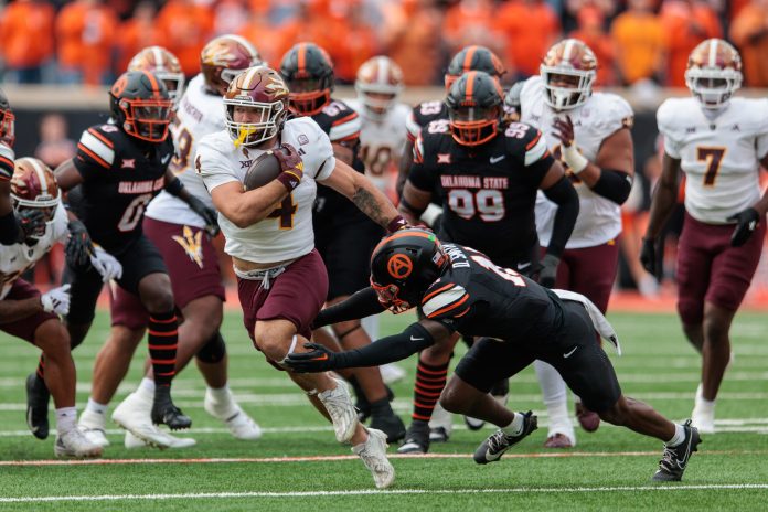 Arizona State Sun Devils running back Cam Skattebo (4) runs the ball during the first quarter against the Oklahoma State Cowboys at Boone Pickens Stadium.