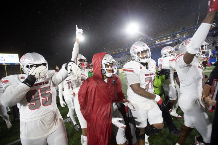 UNLV Rebels players celebrate their victory over the San Jose State Spartans at CEFCU Stadium.