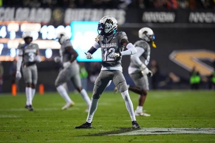 Colorado Buffaloes cornerback Travis Hunter (12) reacts to a play in the second quarter against the Cincinnati Bearcats at Folsom Field.