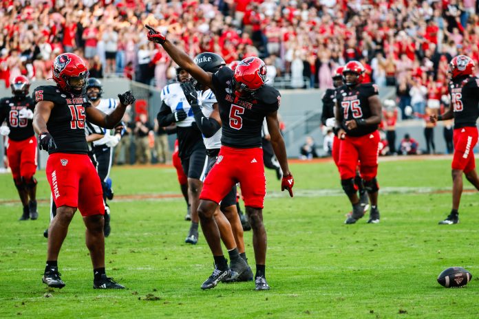 North Carolina State Wolfpack wide receiver Noah Rogers (5) celebrates during the first half of the game against Duke Blue Devils at Carter-Finley Stadium.