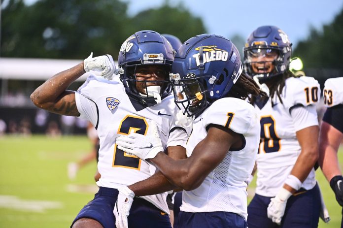 Toledo Rockets wide receiver Junior Vandeross III (2) reacts with Toledo Rockets wide receiver Jerjuan Newton (1) after a touchdown against Mississippi State Bulldogs during the first quarter at Davis Wade Stadium at Scott Field.