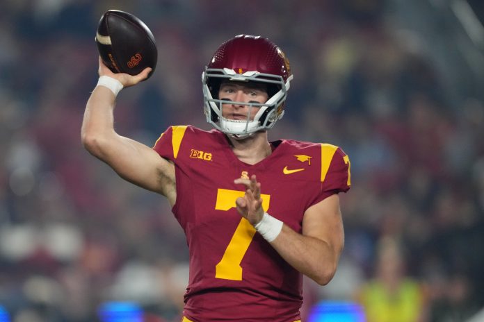 Southern California Trojans quarterback Miller Moss (7) throws the ball against the Rutgers Scarlet Knights in the first half at United Airlines Field at Los Angeles Memorial Coliseum.