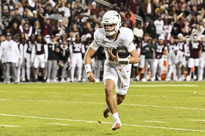 Texas Longhorns quarterback Arch Manning (16) runs the ball during the first half against the Texas A&M Aggies at Kyle Field.