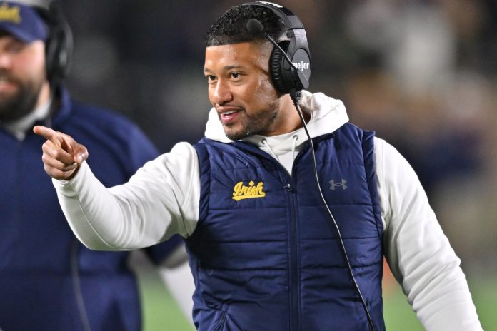 Notre Dame Fighting Irish head coach Marcus Freeman reacts after a Fighting Irish touchdown against the Florida State Seminoles in the third quarter at Notre Dame Stadium.