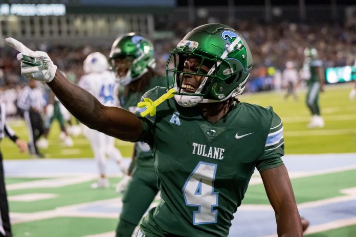 Tulane Green Wave wide receiver Mario Williams (4) celebrates a touchdown reception against Memphis Tigers defensive back Greg Rubin (not pictured) during the first quarter at Yulman Stadium.