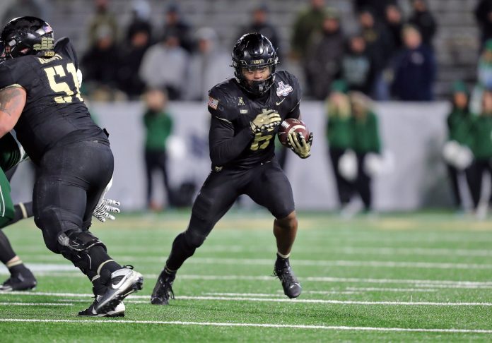 Army Black Knights running back Kanye Udoh (6) runs the ball against the Tulane Green Wave during the second half at Michie Stadium.