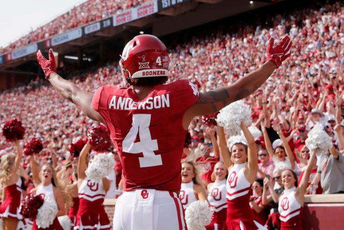 Oklahoma's Nic Anderson (4) celebrates a touchdown in the first half of the college football game between the University of Oklahoma Sooners and the University of Central Florida Knights at Gaylord Family Oklahoma-Memorial Stadium in Norman, Okla., Saturday, Oct., 21, 2023.