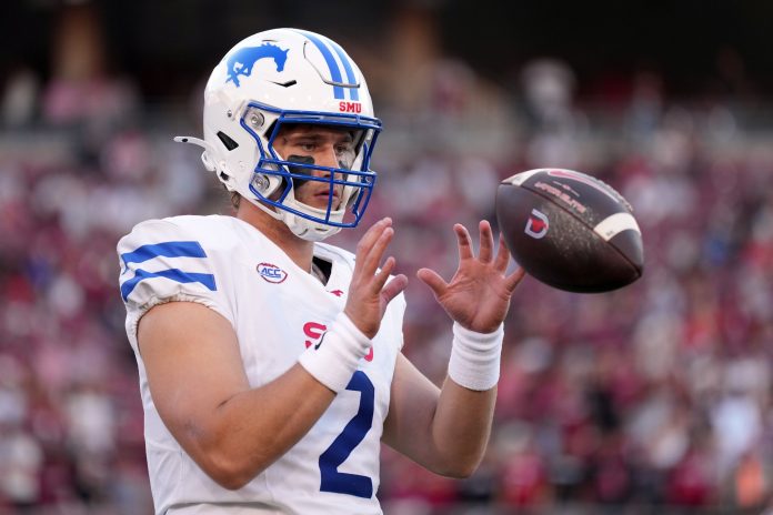 Southern Methodist Mustangs quarterback Preston Stone (2) warms up during the first quarter against the Stanford Cardinal at Stanford Stadium.