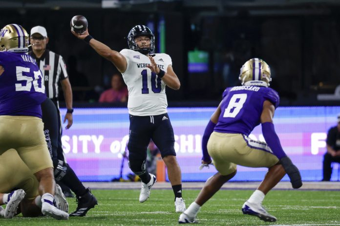 Weber State Wildcats quarterback Richie Munoz (10) passes against the Washington Huskies during the first quarter at Alaska Airlines Field at Husky Stadium.