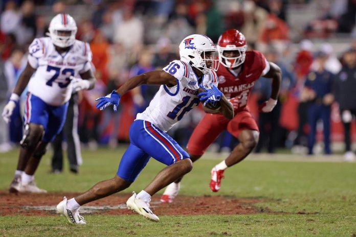 Louisiana Tech Bulldogs wide receiver Tru Edwards (16) runs after a catch in the fourth quarter against the Arkansas Razorbacks at Donald W. Reynolds Razorback Stadium. Arkansas won 35-14.