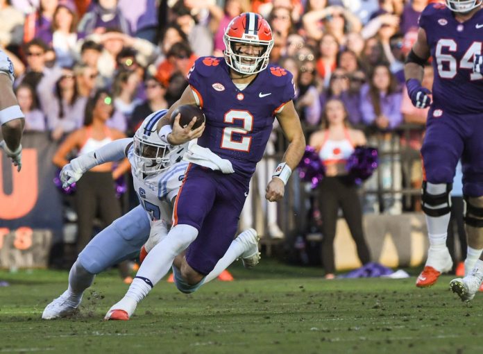 Clemson Tigers quarterback Cade Klubnik (2) runs for a first down against The Citadel Bulldogs during the second quarter at Memorial Stadium.