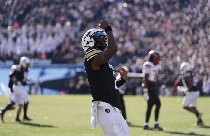 Colorado Buffaloes quarterback Shedeur Sanders (2) celebrates a third quarter touchdown pass against the Oklahoma State Cowboys at Folsom Field.