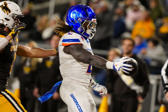 Boise State Broncos running back and Heisman Trophy candidate Ashton Jeanty (2) runs for a touchdown against the Wyoming Cowboys during the first quarter at Jonah Field at War Memorial Stadium.