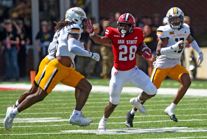 Jacksonville State's Tre Stewart tries to evade the tackle of Southern Miss' Jay Jones during college football action at Burgess-Snow Field AmFirst Stadium in Jacksonville, Alabama September 21, 2024. (Dave Hyatt / Special to the Gadsden Times)