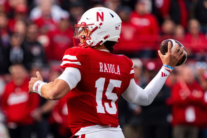 Nebraska Cornhuskers quarterback Dylan Raiola (15) throws against the Wisconsin Badgers during the first quarter at Memorial Stadium.