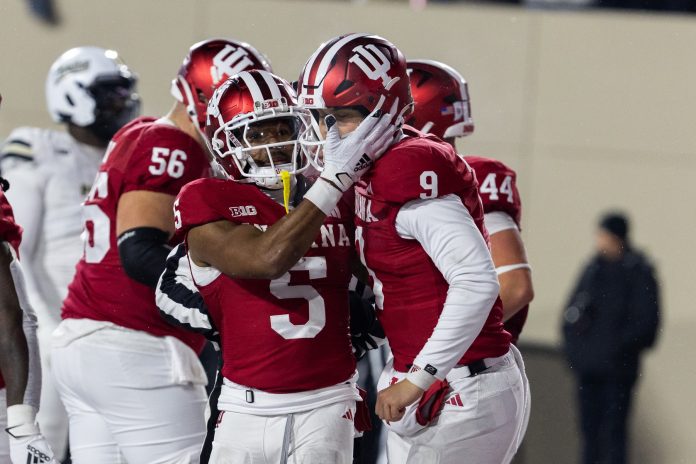 Indiana Hoosiers wide receiver Ke'Shawn Williams (5) celebrates his touchdown with Indiana Hoosiers quarterback Kurtis Rourke (9) in the first half against the Purdue Boilermakers at Memorial Stadium.