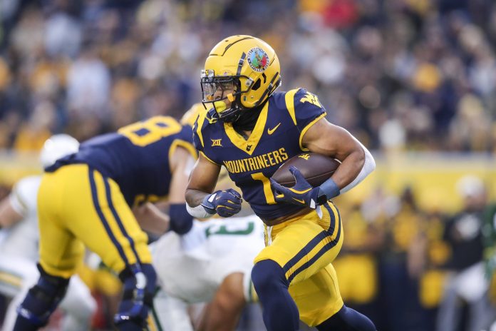 West Virginia Mountaineers running back Jahiem White (1) runs the ball during the first quarter against the Baylor Bears at Mountaineer Field at Milan Puskar Stadium.