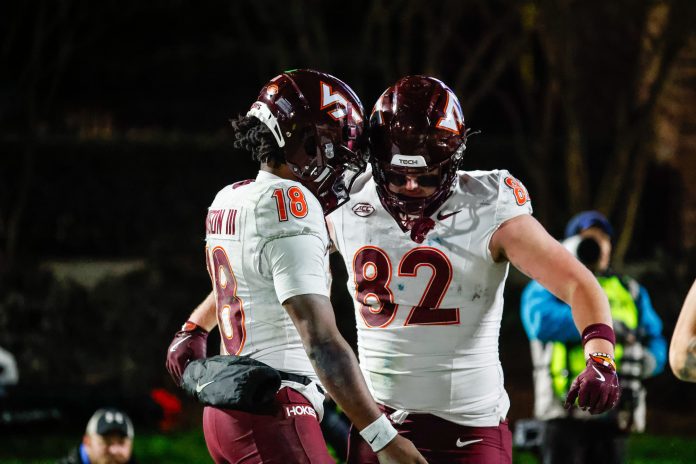 Virginia Tech Hokies quarterback William Watson III (18) and tight end Benji Gosnell (82) celebrates a touchdown during the second half of the game against Duke Blue Devils at Wallace Wade Stadium.